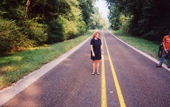 The primary witness stands in the highway where she and her son first saw the subject.