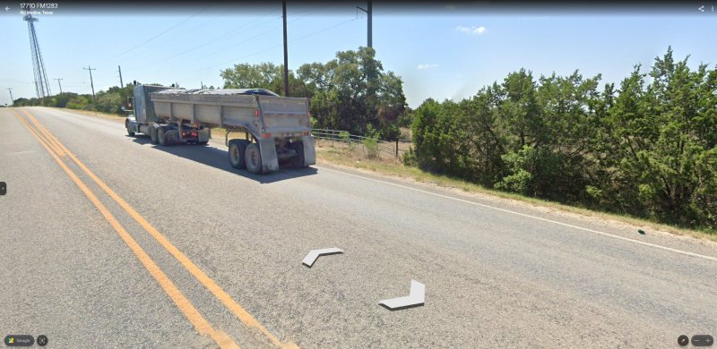 Google road view: The animal was traveling from South to North across FM 1283, and appeared to come from the double gates; foot impressions were found here